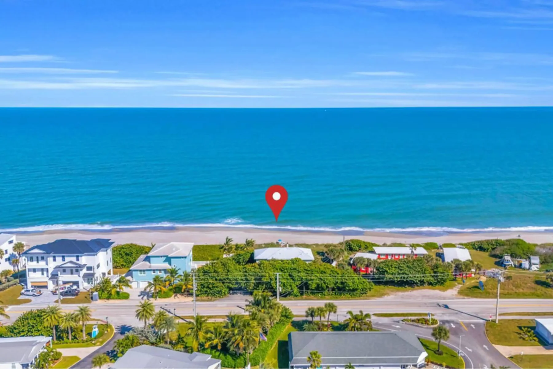 Aerial view of the coastline and neighborhood